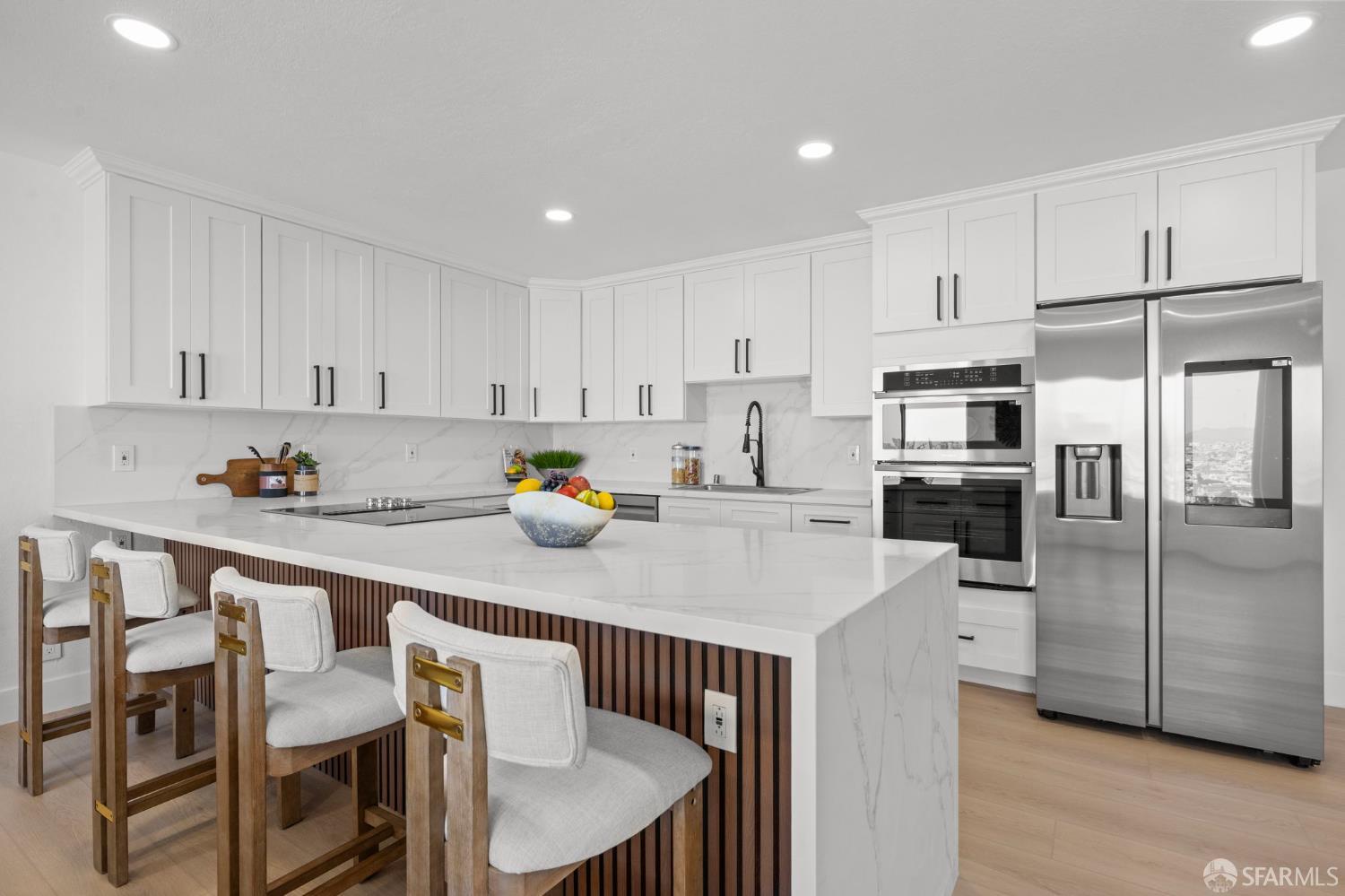 226 Rutledge Street San Francisco, CA 94110 - Photo 5 of 44 a kitchen with stainless steel appliances a table chairs refrigerator and cabinets