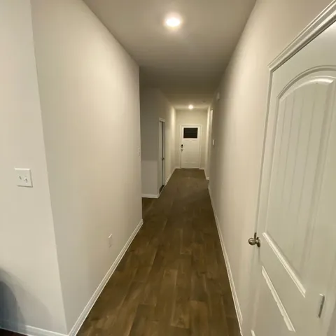 a view of an empty room with closet area