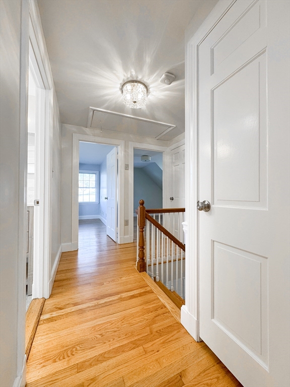 40 Walter Street, Unit 1 Lynn, MA 01902 - Photo 25 of 40 view of a hallway with wooden floor and staircase