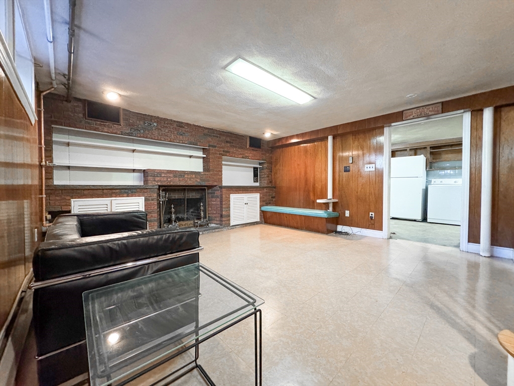 40 Walter Street, Unit 1 Lynn, MA 01902 - Photo 32 of 40 a view of an empty room with a fireplace