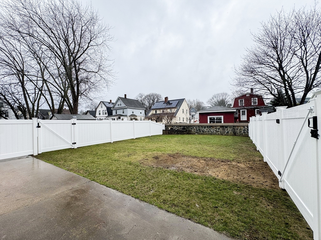 40 Walter Street, Unit 1 Lynn, MA 01902 - Photo 34 of 40 a view of a backyard with large trees