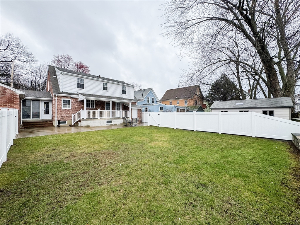 40 Walter Street, Unit 1 Lynn, MA 01902 - Photo 35 of 40 a view of a house with a backyard