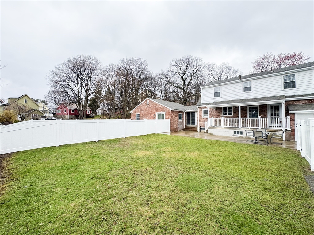 40 Walter Street, Unit 1 Lynn, MA 01902 - Photo 36 of 40 a front view of a house with yard and green space