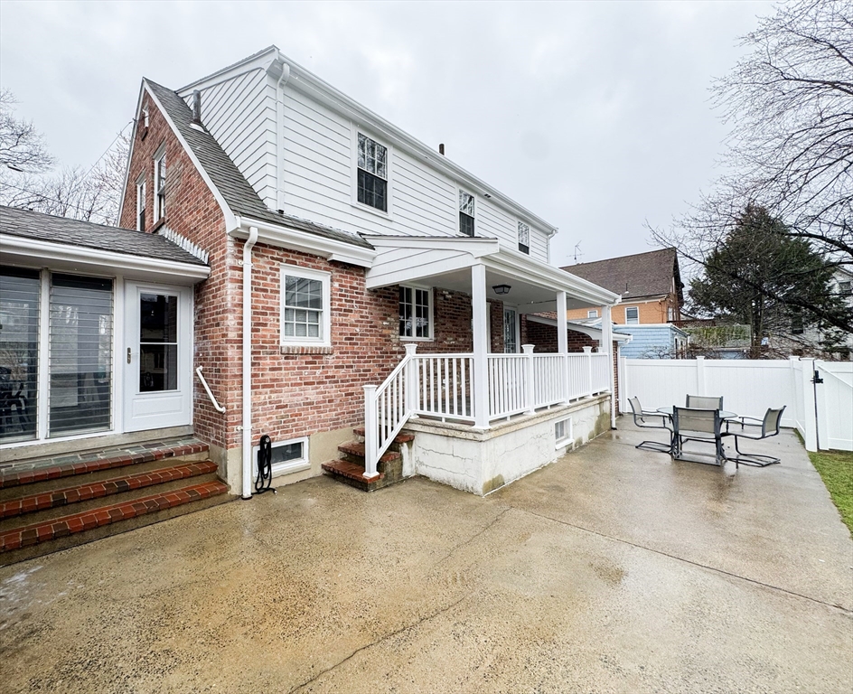 40 Walter Street, Unit 1 Lynn, MA 01902 - Photo 39 of 40 a view of a house with a yard and sitting area