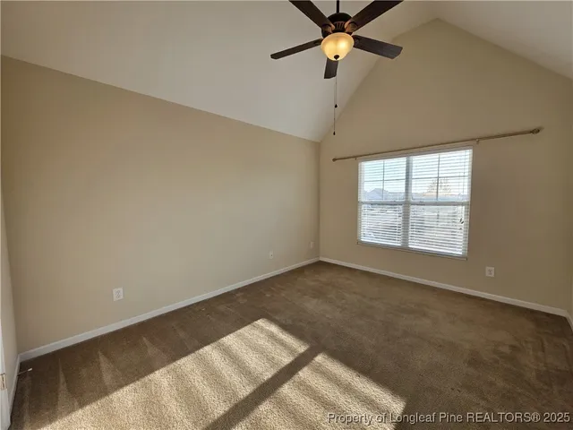 a white toilet sitting next to a white sink