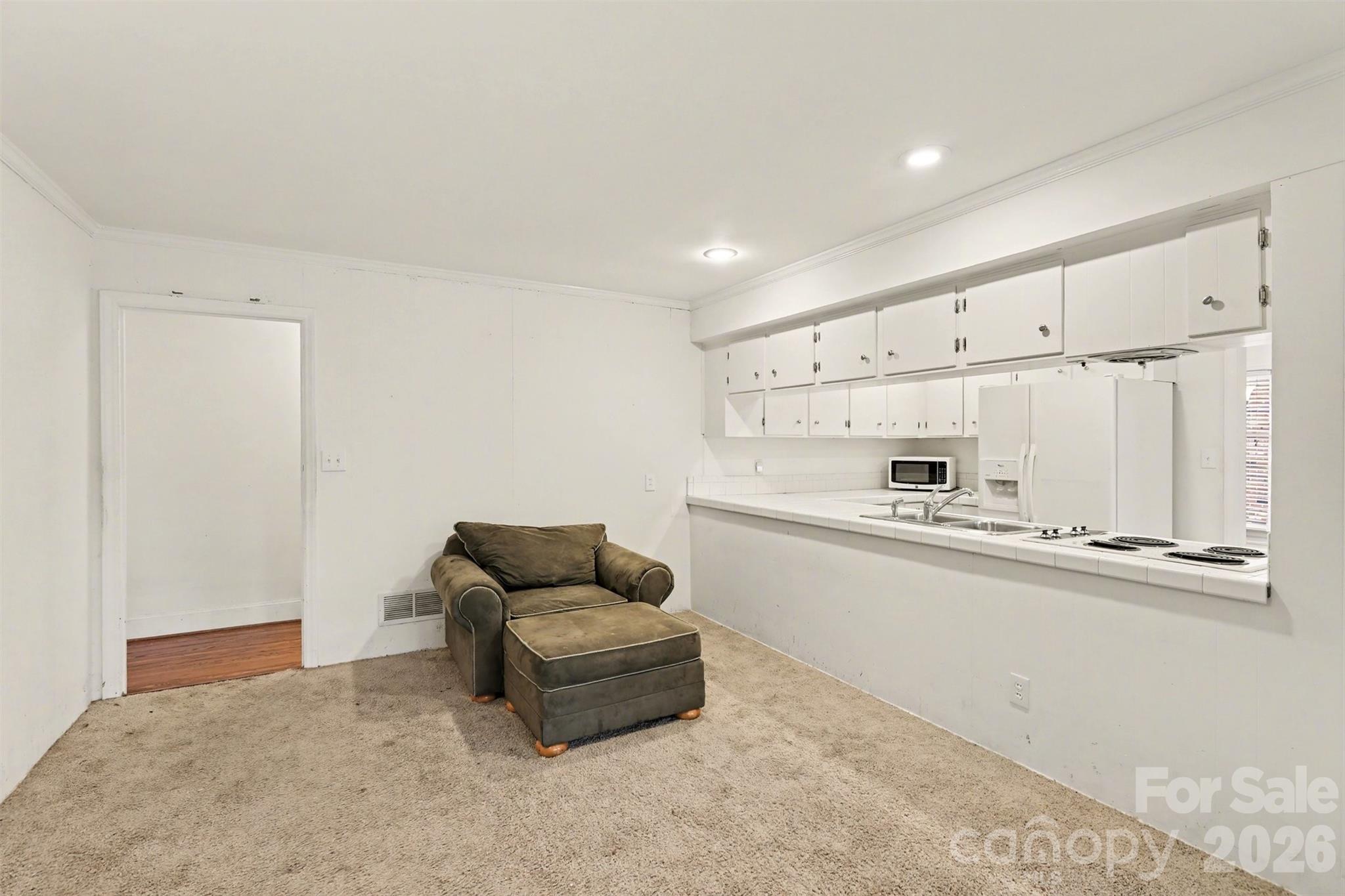 3101 Eastburn Road Charlotte, NC 28210 - Photo 11 of 31 a kitchen with stainless steel appliances a refrigerator and a stove top oven
