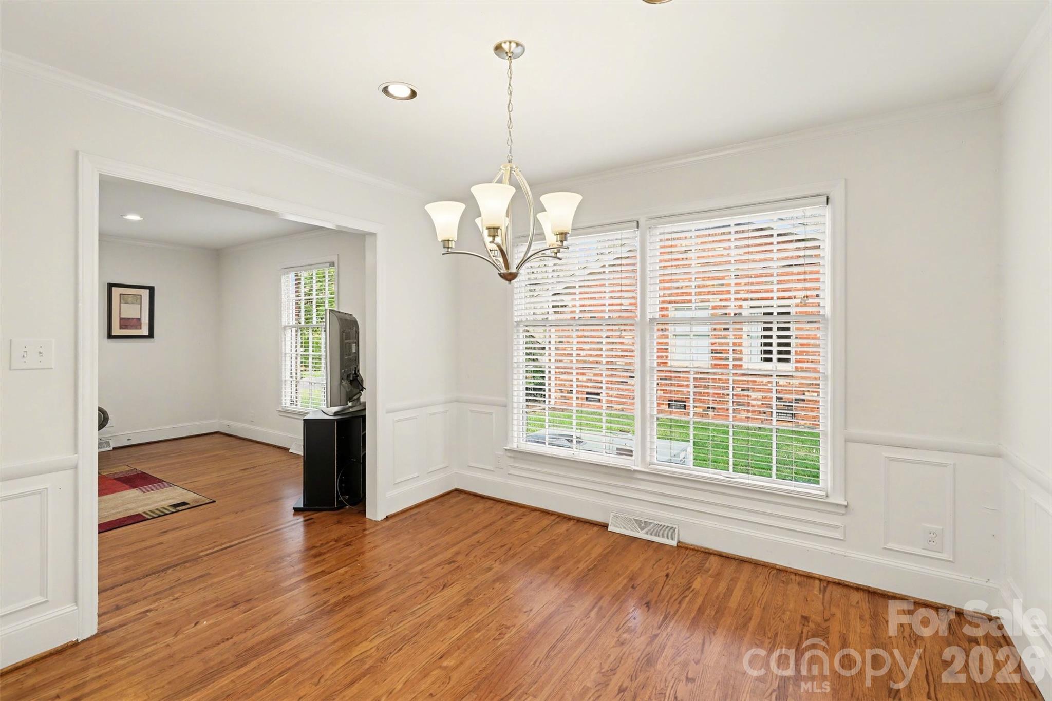 3101 Eastburn Road Charlotte, NC 28210 - Photo 13 of 31 a view of empty room with wooden floor and fan