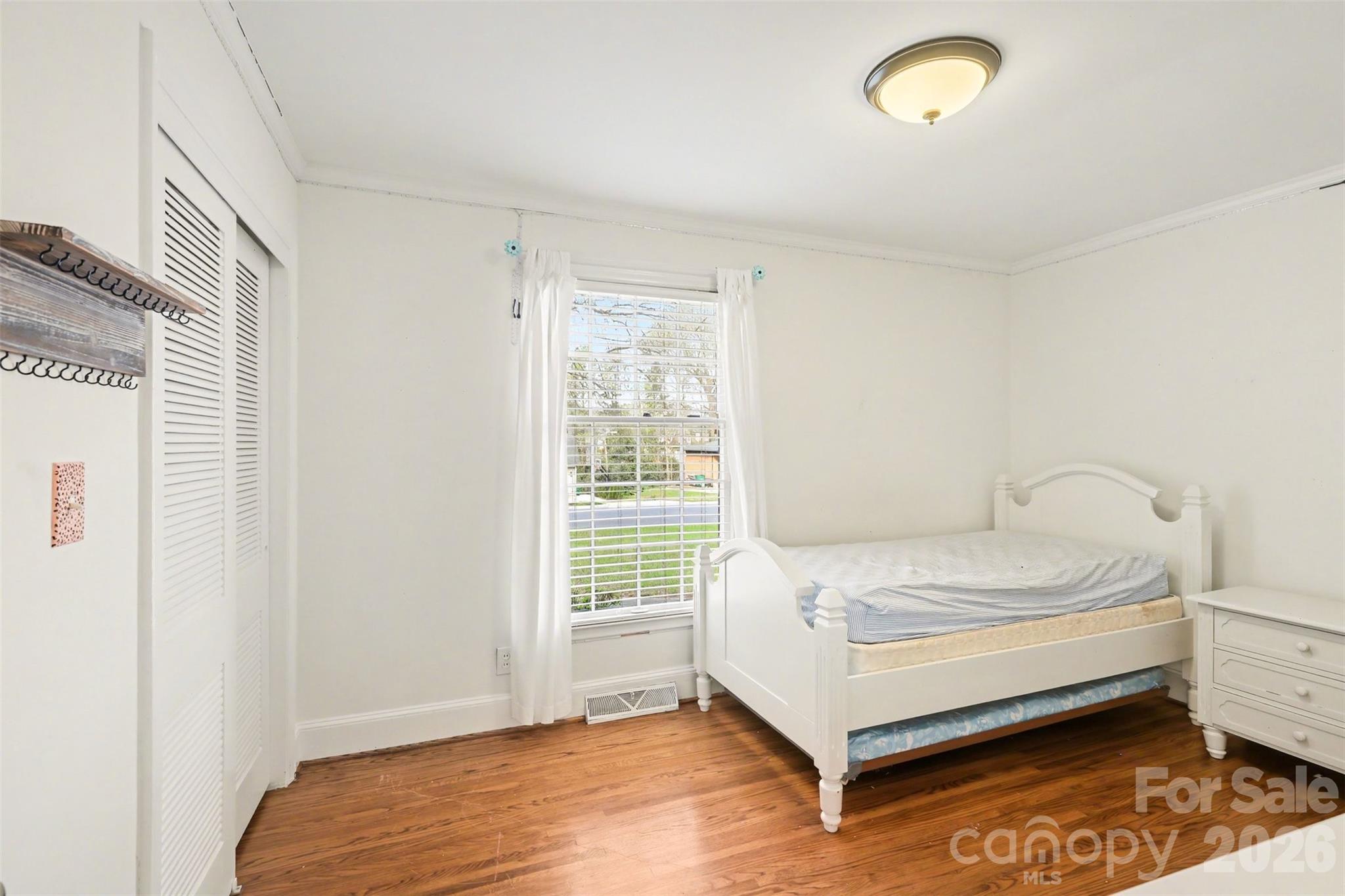 3101 Eastburn Road Charlotte, NC 28210 - Photo 19 of 31 a bedroom with a bed and a window