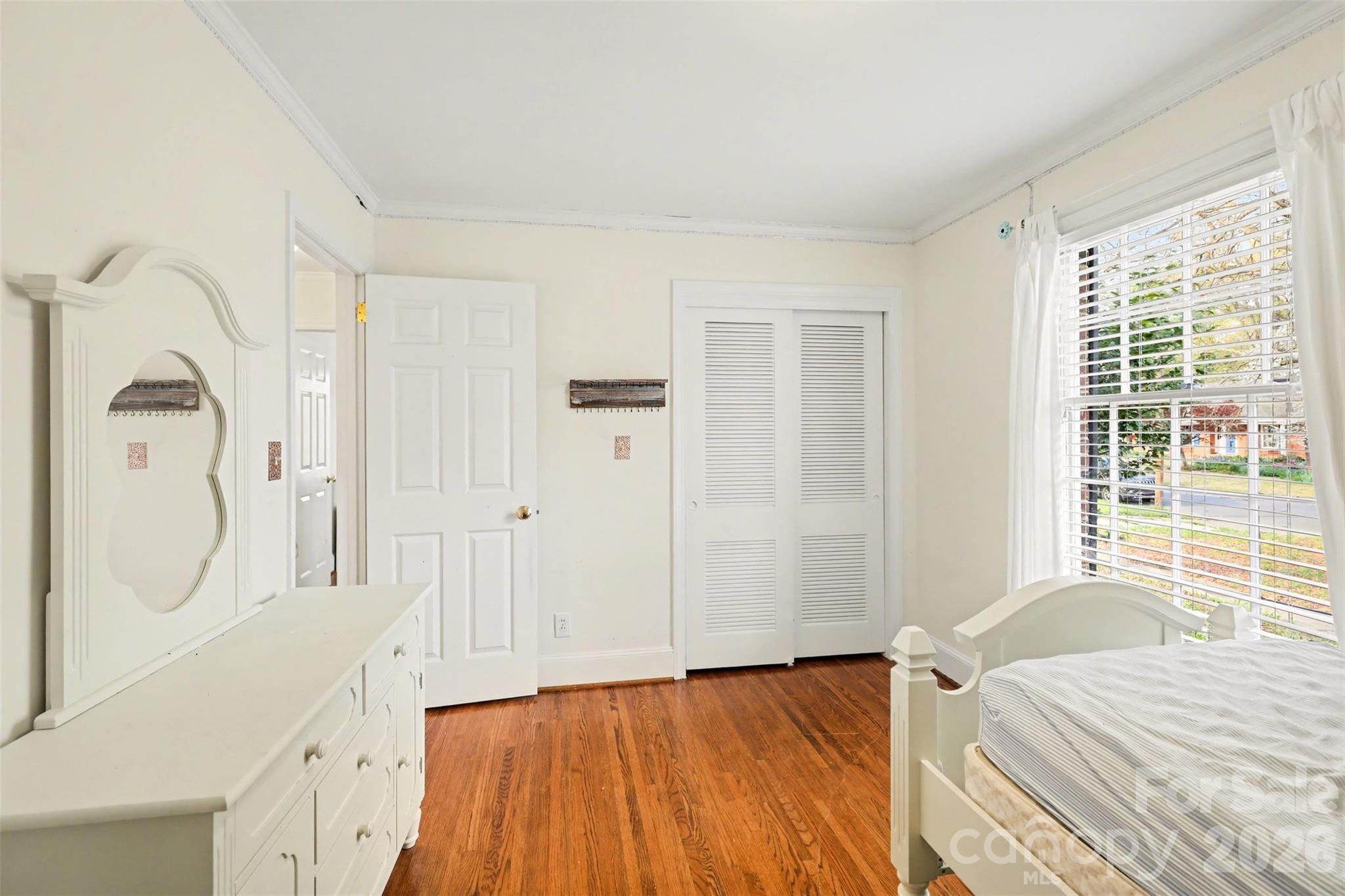 3101 Eastburn Road Charlotte, NC 28210 - Photo 21 of 31 a bedroom with a bed and a mirror