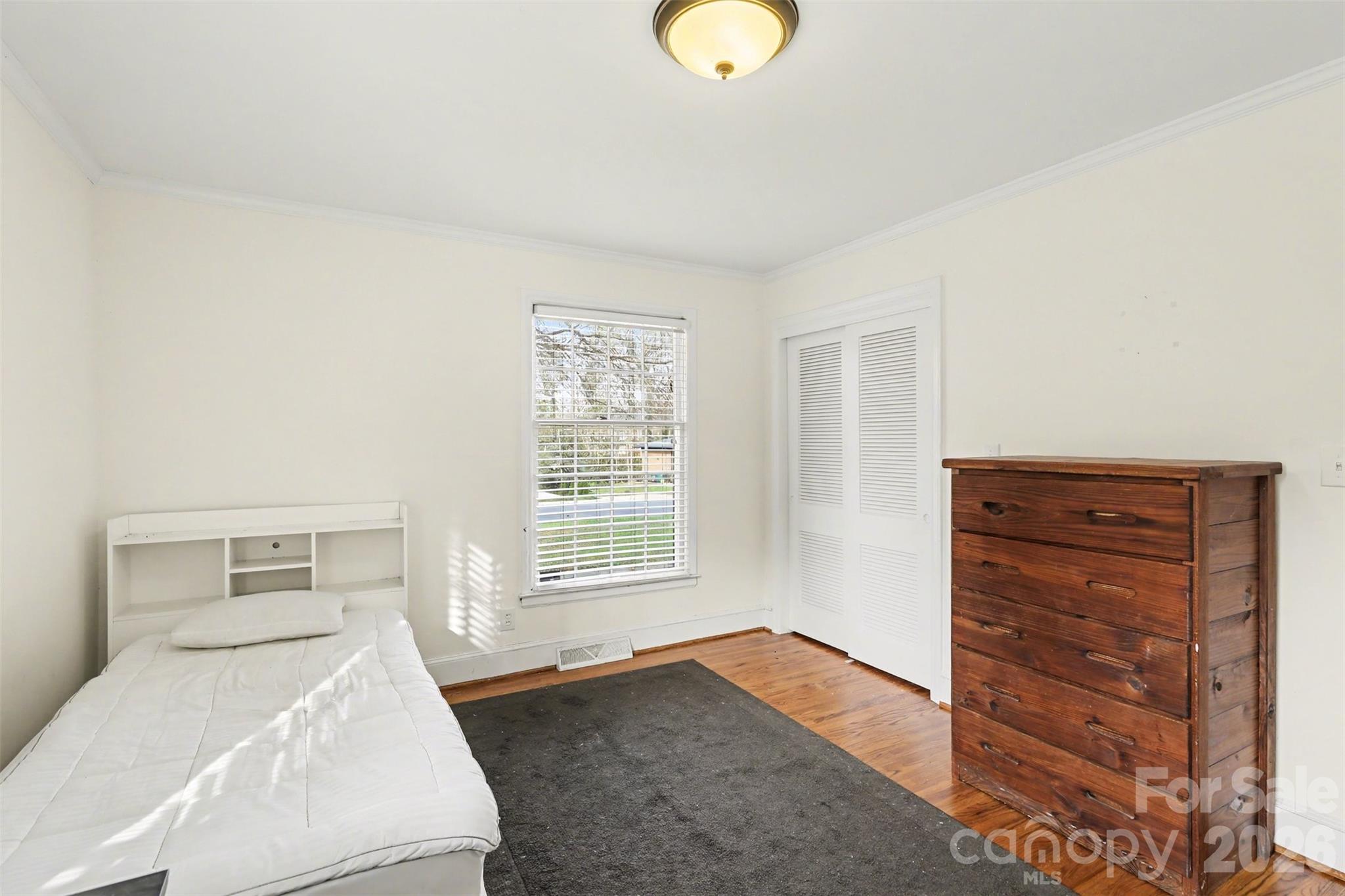 3101 Eastburn Road Charlotte, NC 28210 - Photo 23 of 31 a bedroom with a bed and a dresser