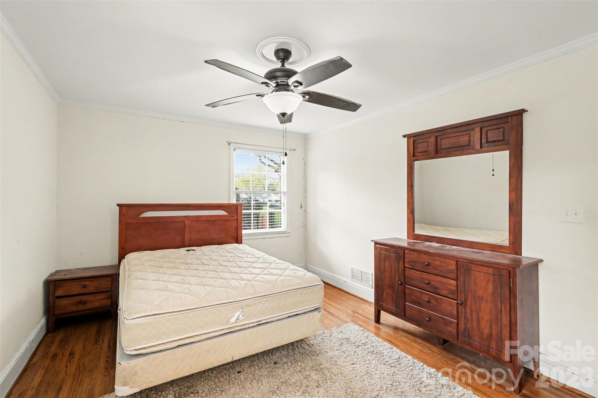 3101 Eastburn Road Charlotte, NC 28210 - Photo 25 of 31 a bedroom with a bed and a dresser