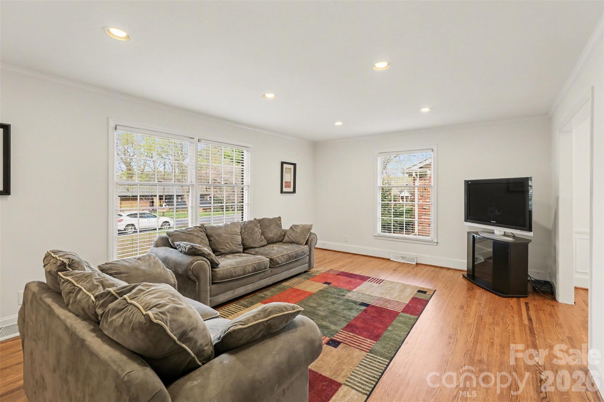 3101 Eastburn Road Charlotte, NC 28210 - Photo 3 of 31 a living room with furniture and a flat screen tv
