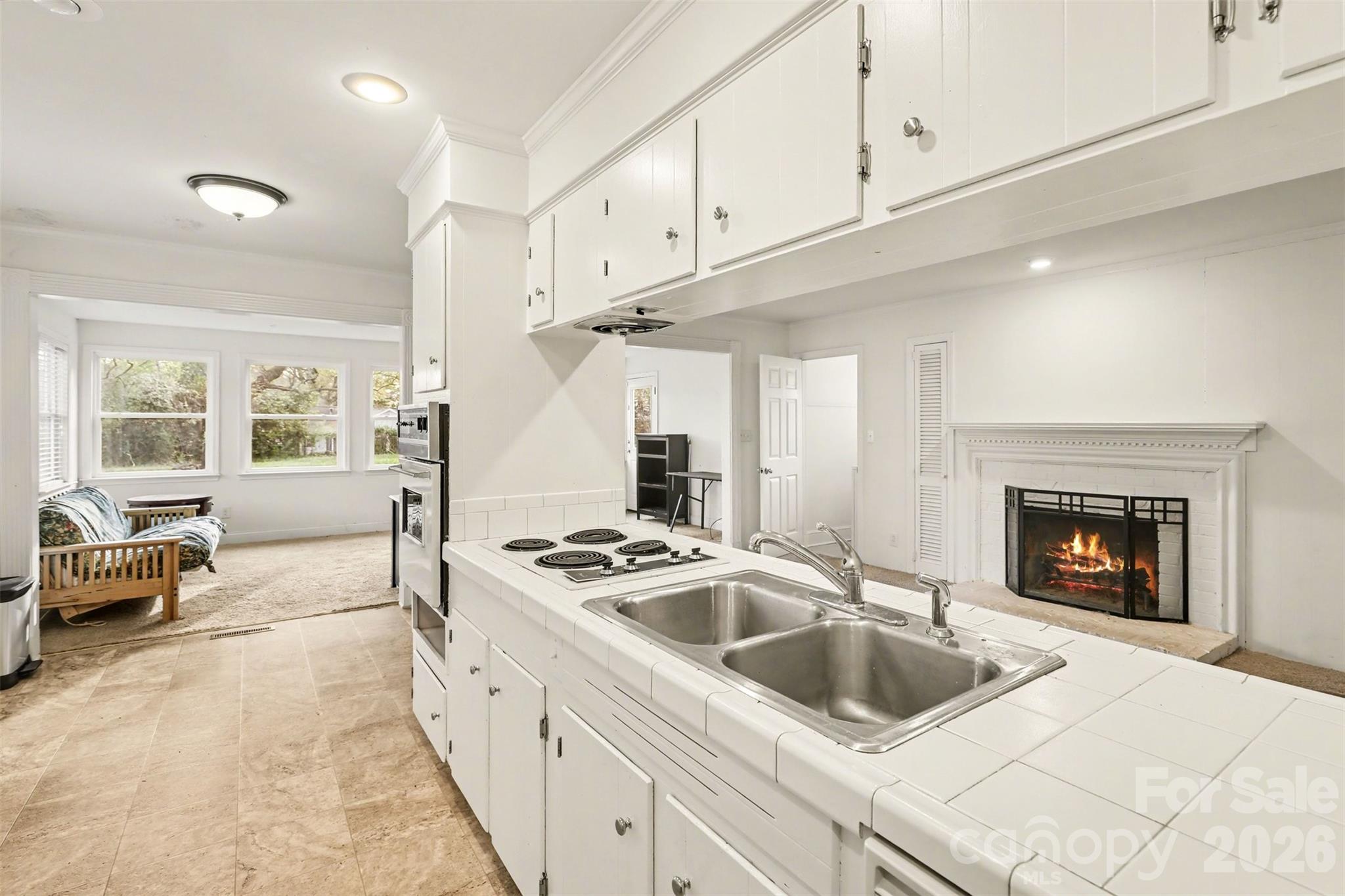 3101 Eastburn Road Charlotte, NC 28210 - Photo 6 of 31 a kitchen with granite countertop a sink a stove and cabinets