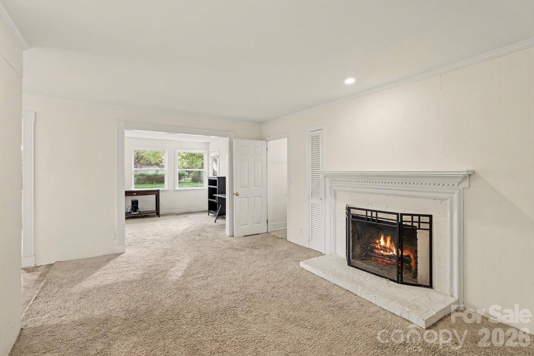 3101 Eastburn Road Charlotte, NC 28210 - Photo 7 of 31 an empty room with furniture and a fireplace