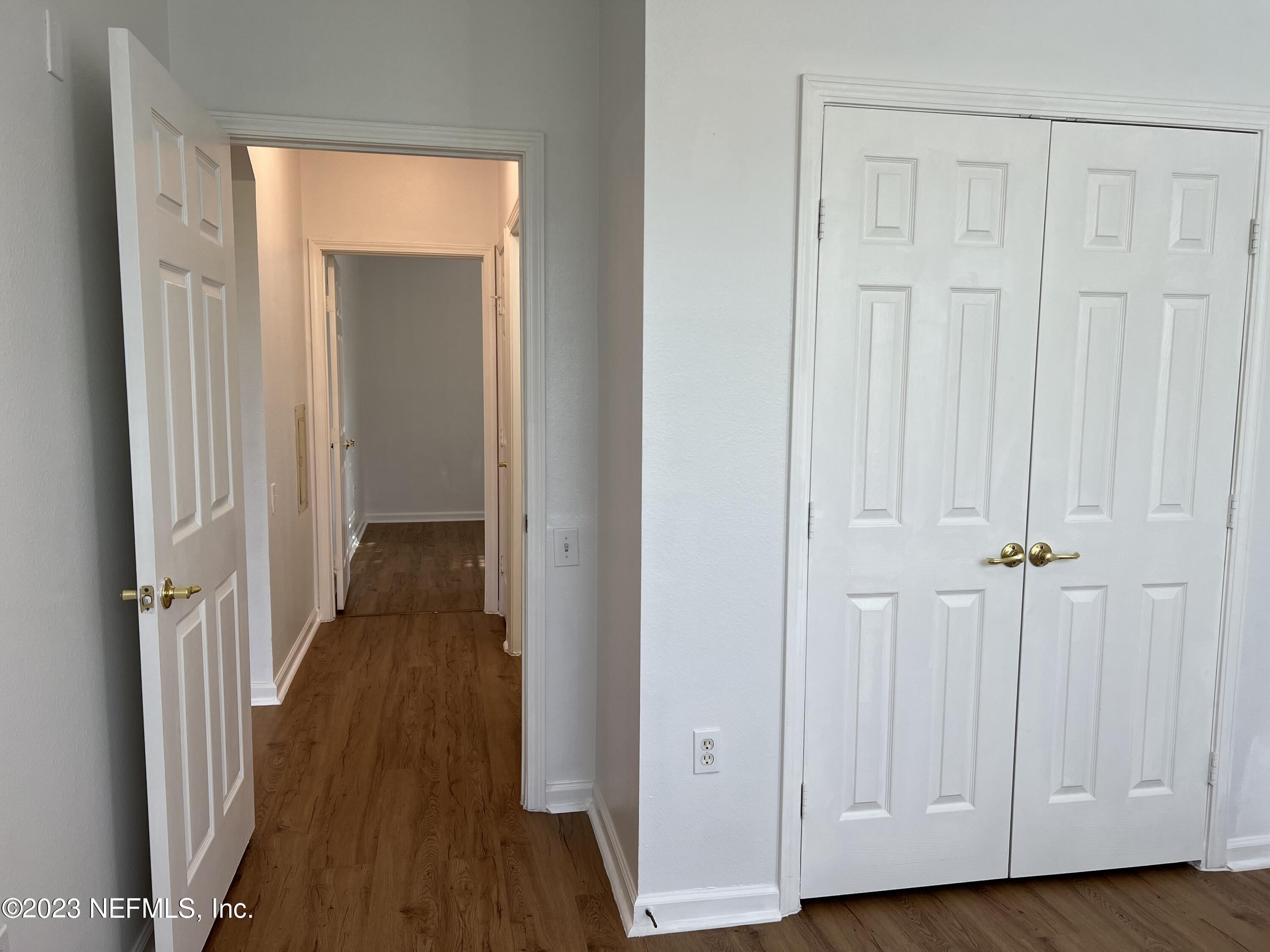 7990 Baymeadows Road East, Unit 418 Jacksonville, FL 32256 - Photo 21 of 25 a view of a hallway with wooden floor