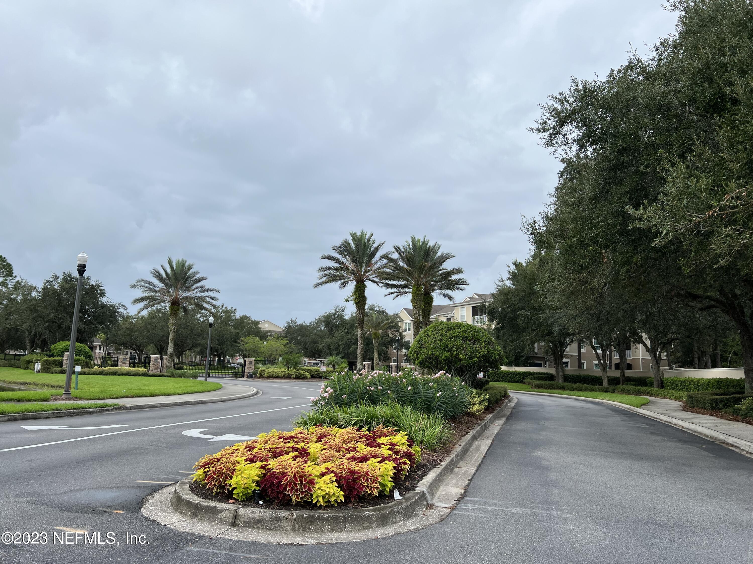 7990 Baymeadows Road East, Unit 418 Jacksonville, FL 32256 - Photo 3 of 25 a view of a swimming pool with a yard