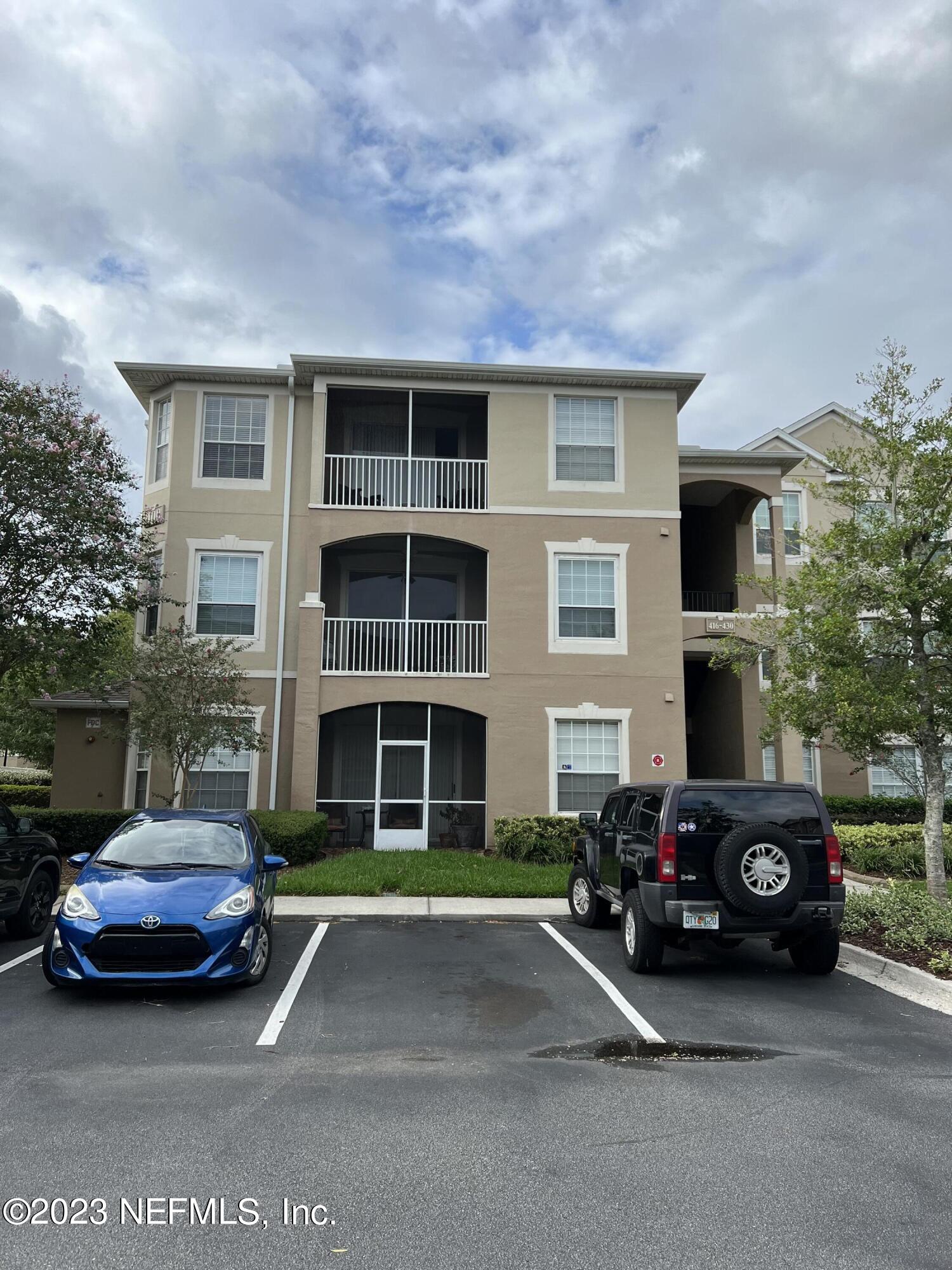 7990 Baymeadows Road East, Unit 418 Jacksonville, FL 32256 - Photo 9 of 25 a car parked in front of a house