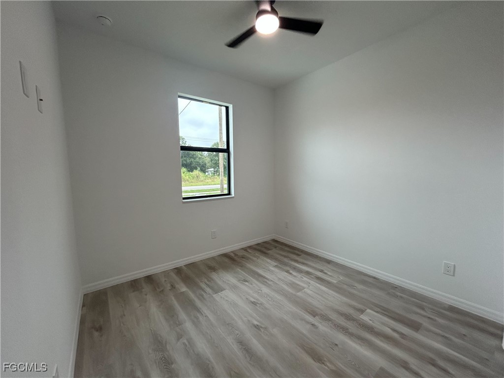 453 Bell Boulevard Lehigh Acres, FL 33974 - Photo 9 of 21 an empty room with a window