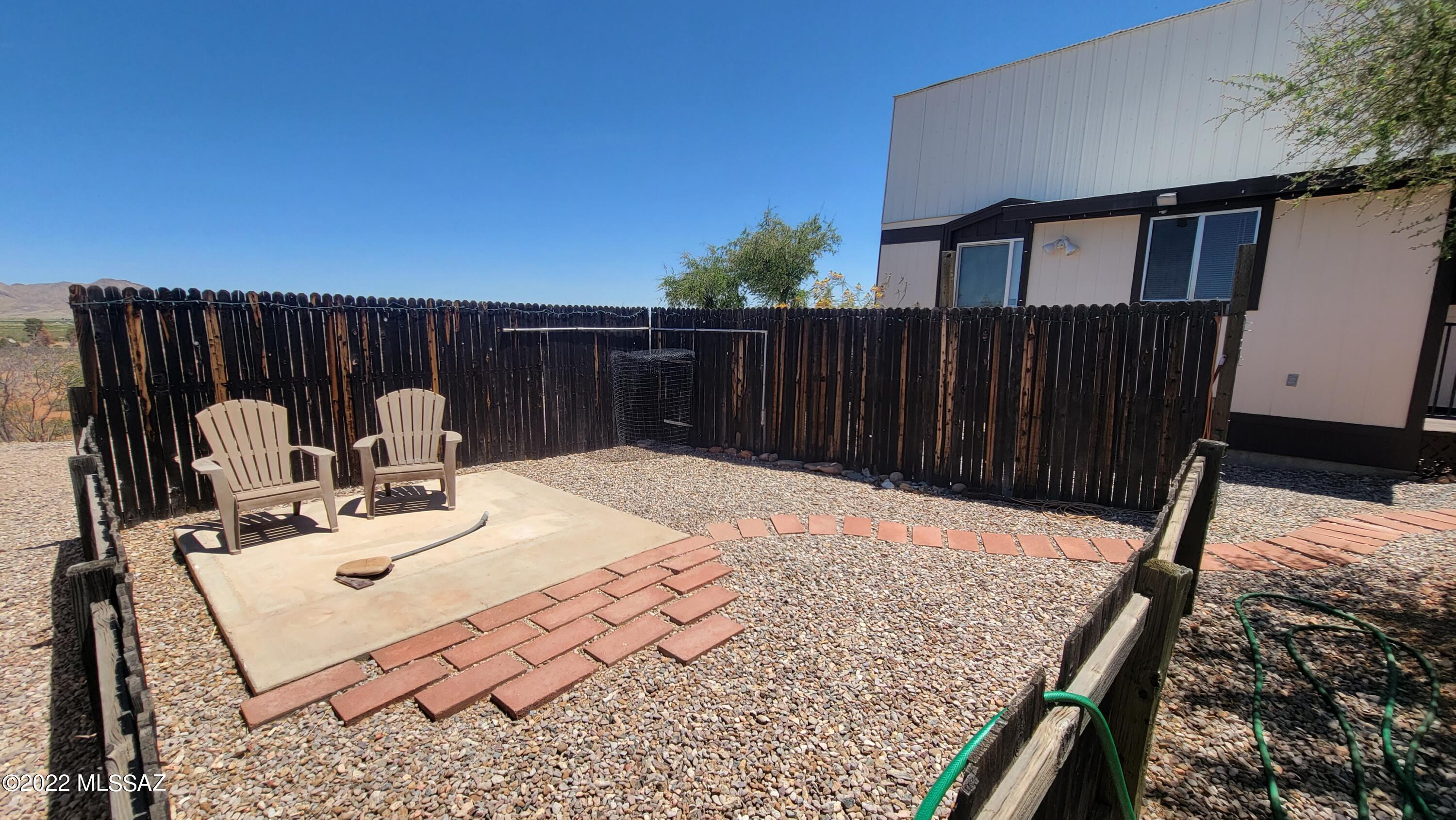 3399 Red Stag Road Pearce, AZ 85625 - Photo 11 of 47 a view of balcony with wooden floor and outdoor seating