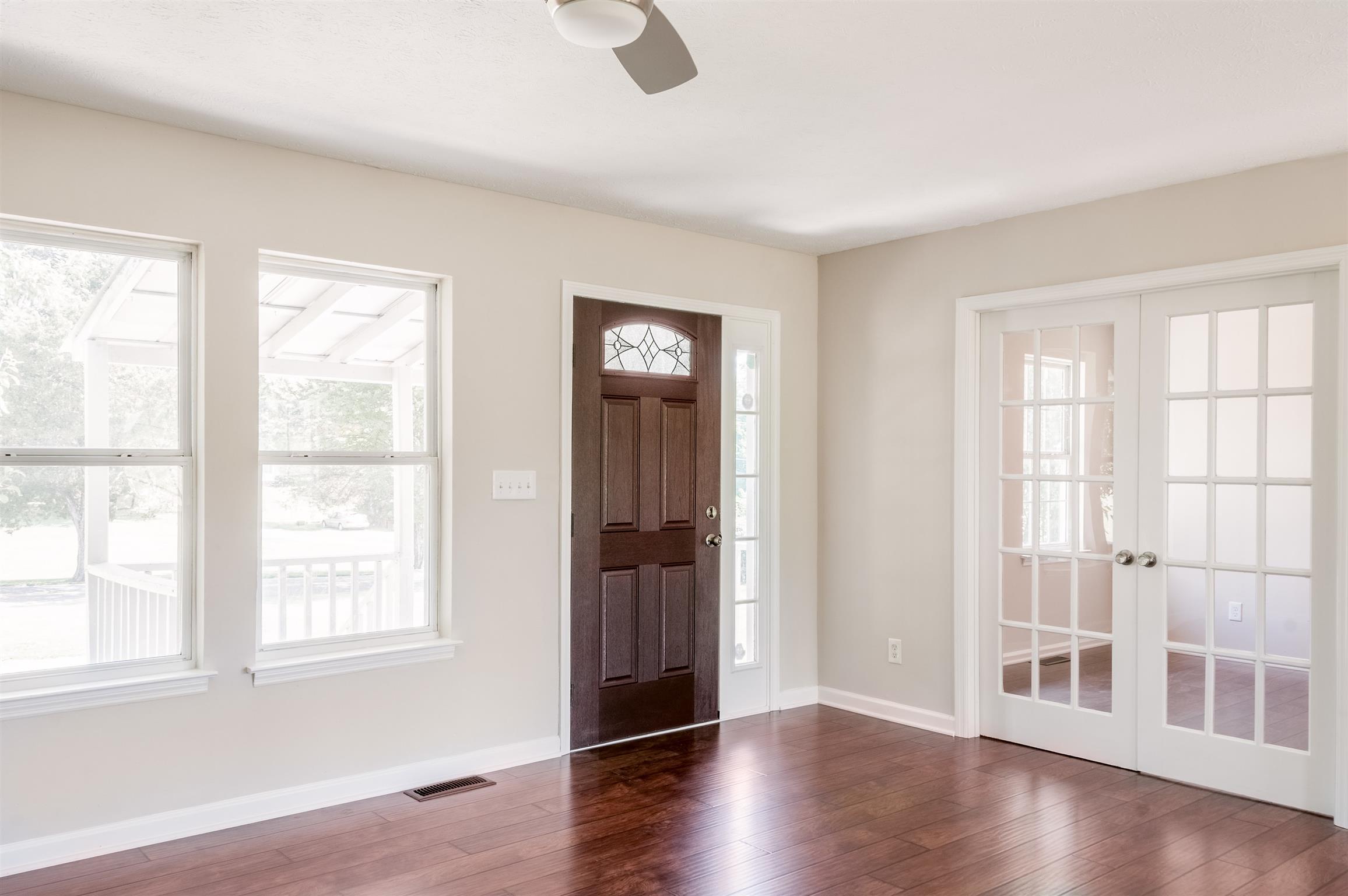 508 Curd Road Mount Juliet, TN 37122 - Photo 3 of 14 a view of an empty room with wooden floor and a window