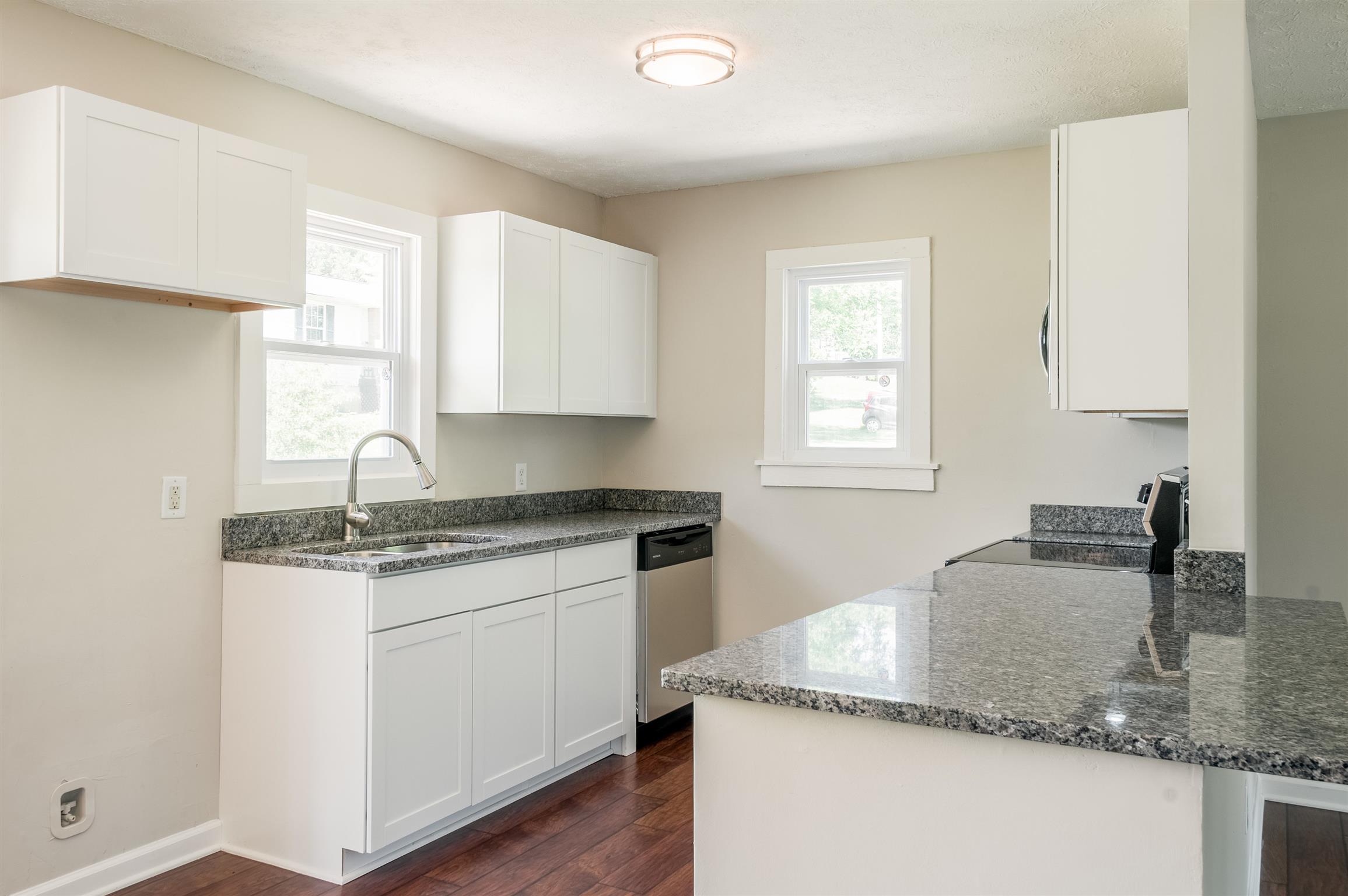 508 Curd Road Mount Juliet, TN 37122 - Photo 6 of 14 a kitchen with granite countertop a sink a window and cabinets