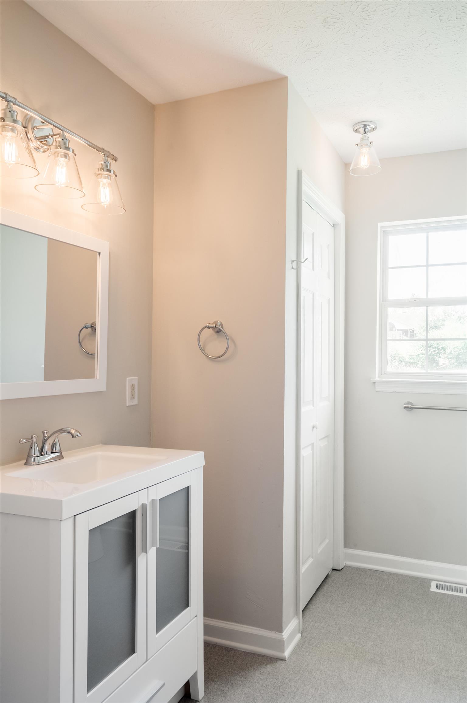 508 Curd Road Mount Juliet, TN 37122 - Photo 9 of 14 a utility room with a sink a vanity and a mirror