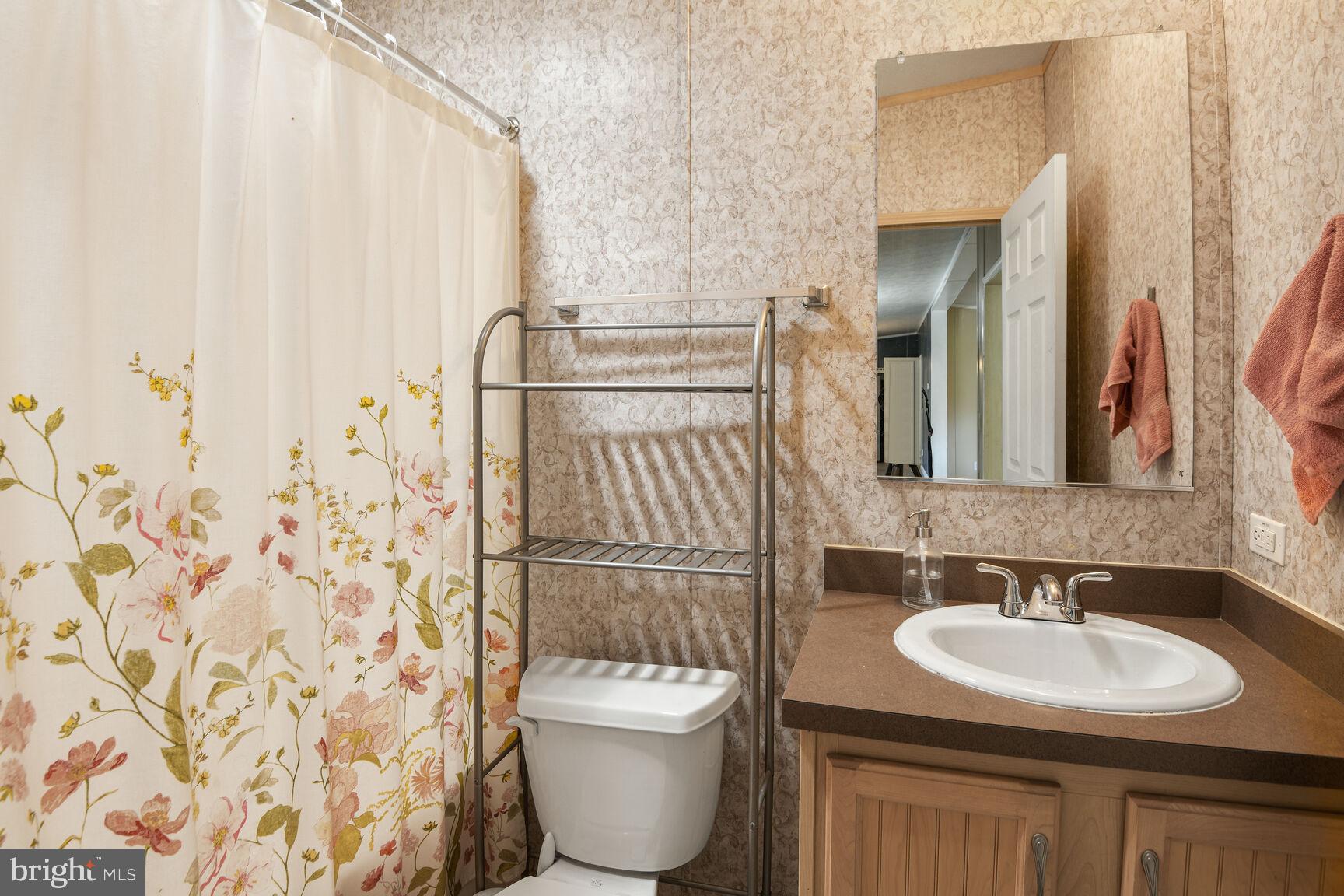 488 North Patuxent Road, Unit 19A Odenton, MD 21113 - Photo 11 of 14 a bathroom with a sink toilet and shower