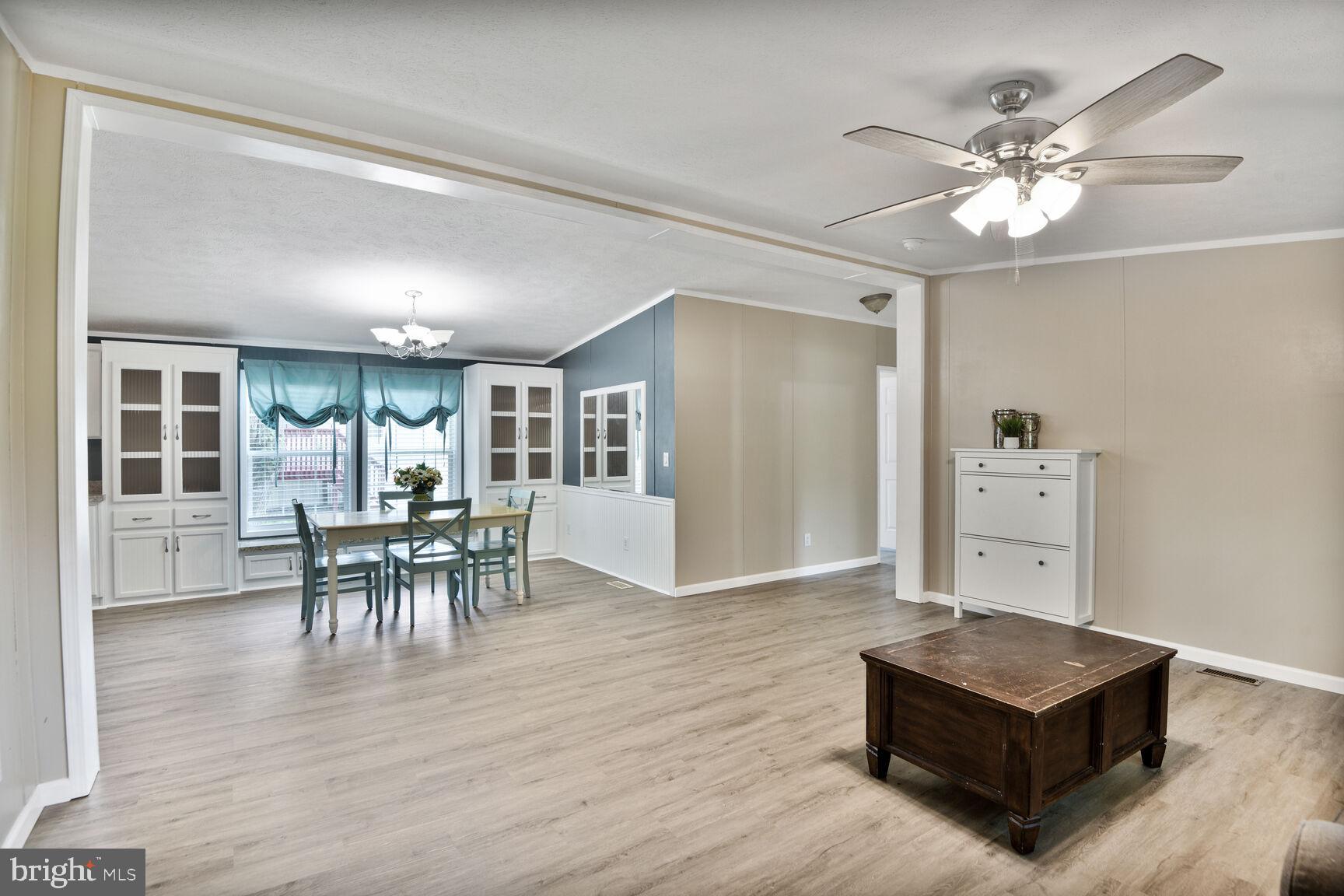 488 North Patuxent Road, Unit 19A Odenton, MD 21113 - Photo 3 of 14 a living room with furniture and wooden floor