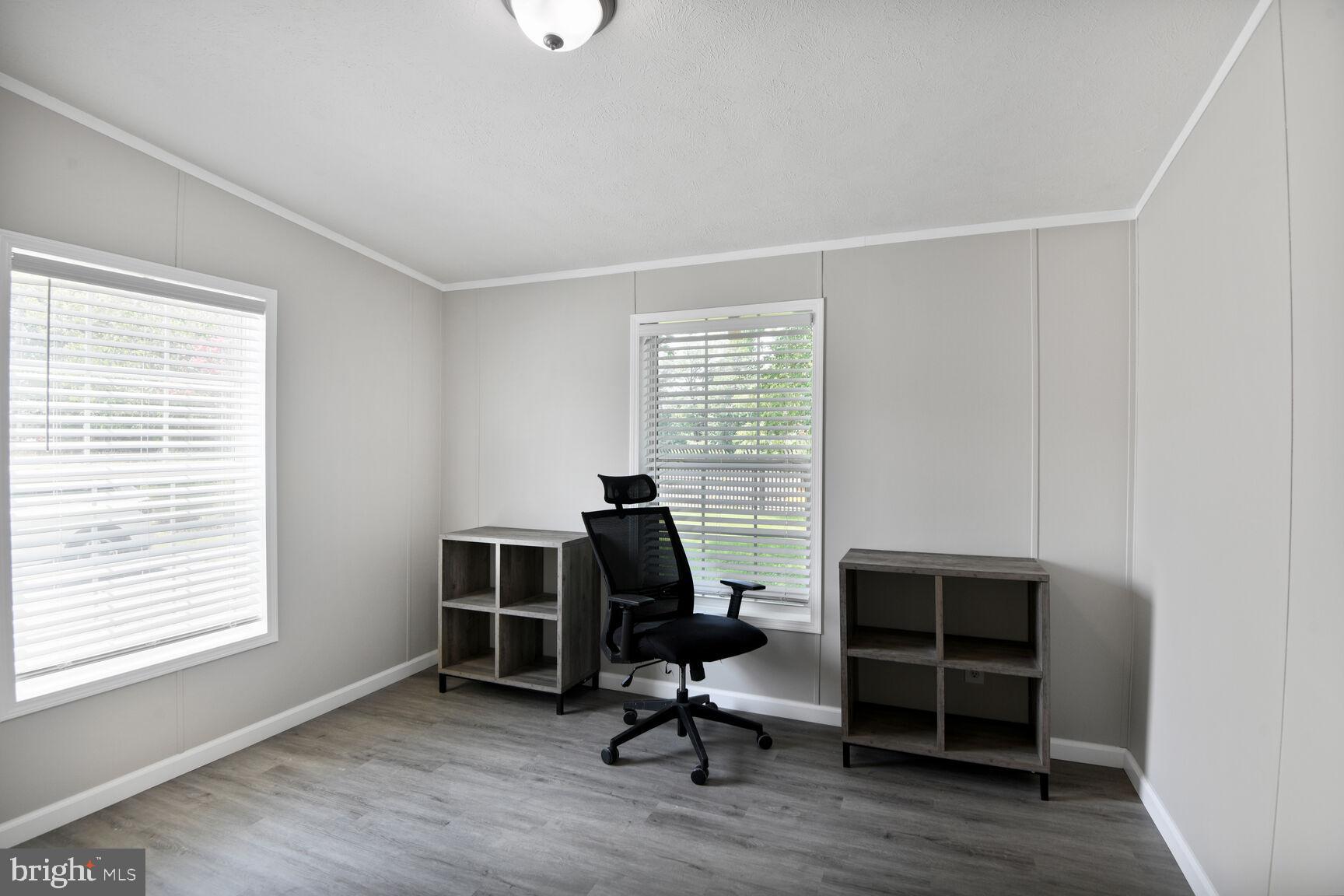 488 North Patuxent Road, Unit 19A Odenton, MD 21113 - Photo 6 of 14 a view of a workspace with furniture and a window
