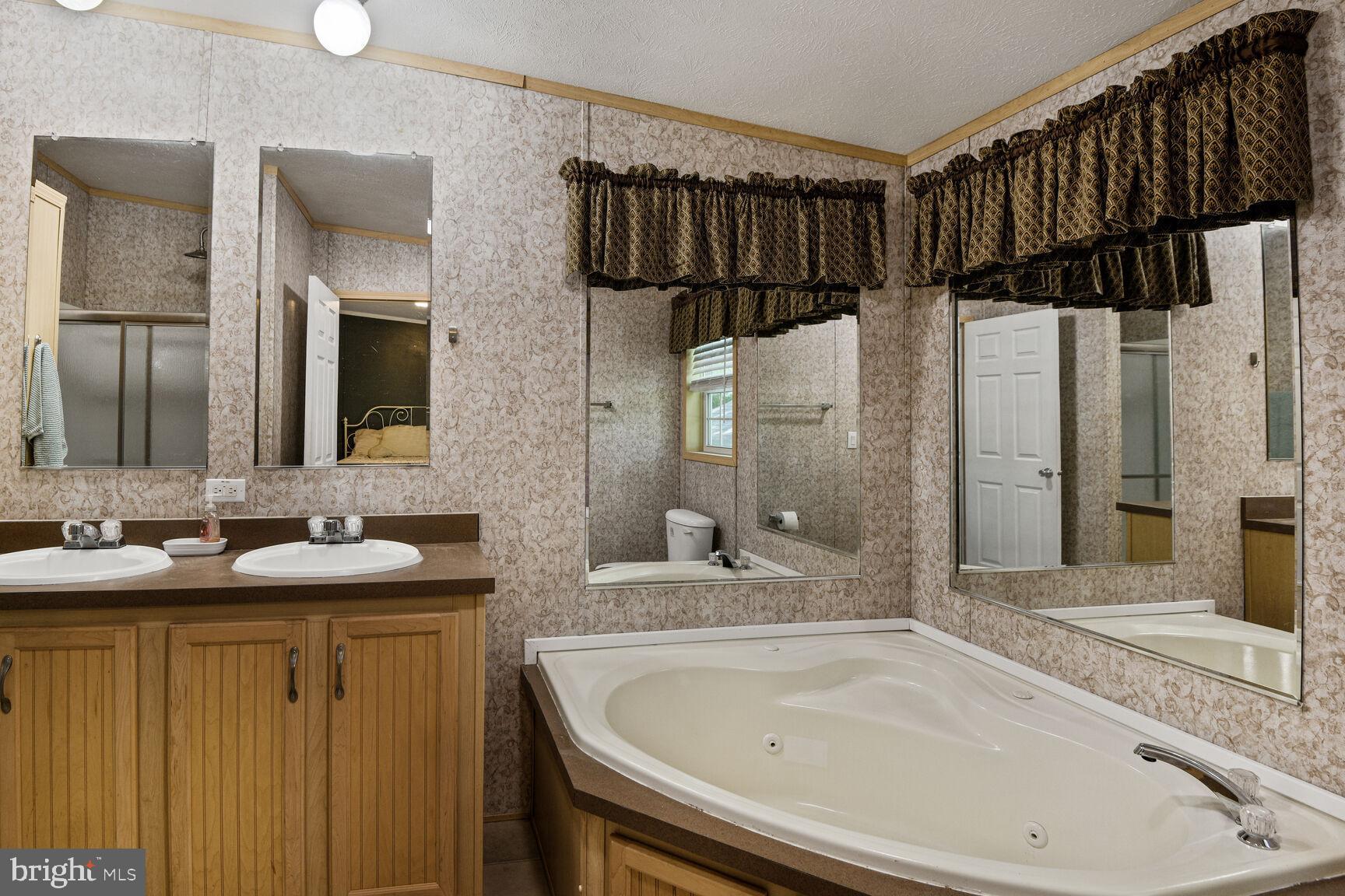 488 North Patuxent Road, Unit 19A Odenton, MD 21113 - Photo 9 of 14 a bathroom with a sink and a mirror