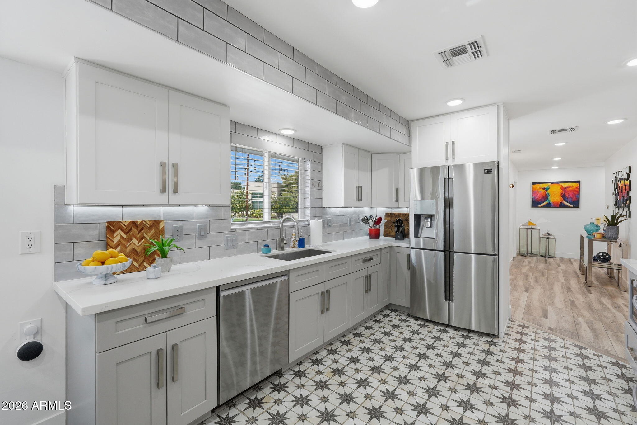 5149 North 34th Street Phoenix, AZ 85018 - Photo 17 of 70 a kitchen with a sink appliances and cabinets