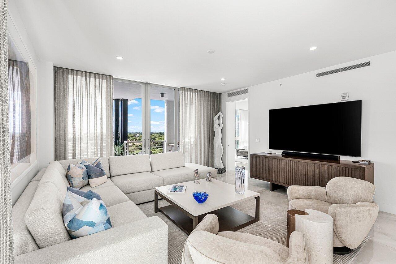 475 East Royal Palm Road, Unit 805 Boca Raton, FL 33432 - Photo 11 of 41 a living room with furniture and a flat screen tv