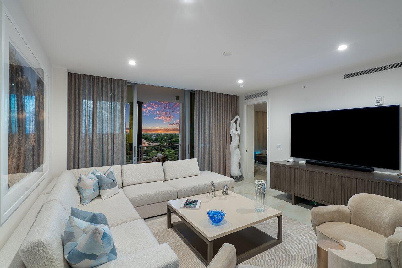 475 East Royal Palm Road, Unit 805 Boca Raton, FL 33432 - Photo 12 of 41 a living room with furniture and a flat screen tv