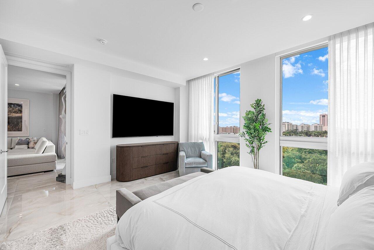475 East Royal Palm Road, Unit 805 Boca Raton, FL 33432 - Photo 15 of 41 a bedroom with a bed and a flat screen tv