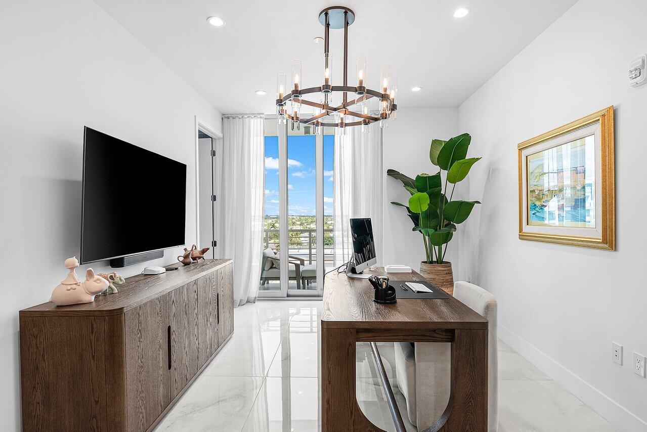 475 East Royal Palm Road, Unit 805 Boca Raton, FL 33432 - Photo 25 of 41 a living room with furniture and a flat screen tv
