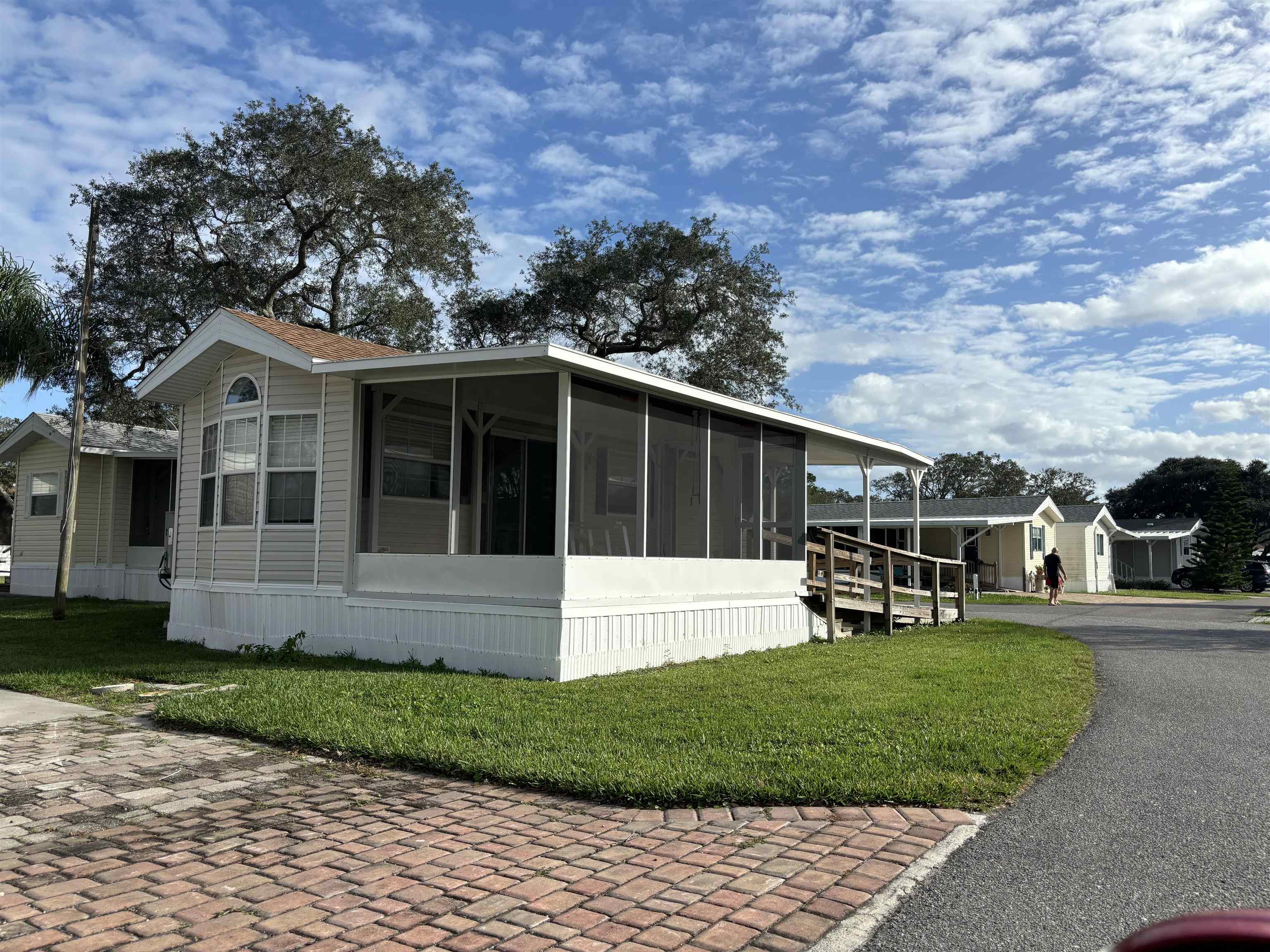 D123 Ocean Grove St. Augustine, FL 32080 - Photo 3 of 7 a view of a house with a yard and pathway