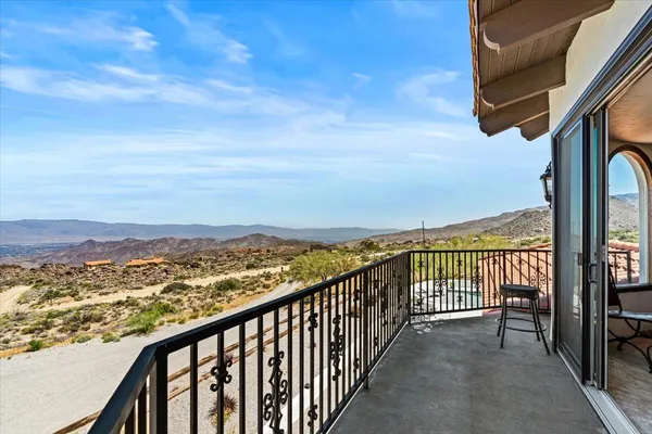 a room with stainless steel appliances kitchen island granite countertop a refrigerator and a stove top oven