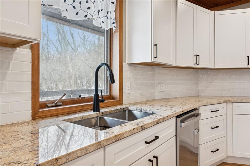 50 Potato Run Road Washington, PA 15301 - Photo 13 of 43 a kitchen with granite countertop a sink and cabinets