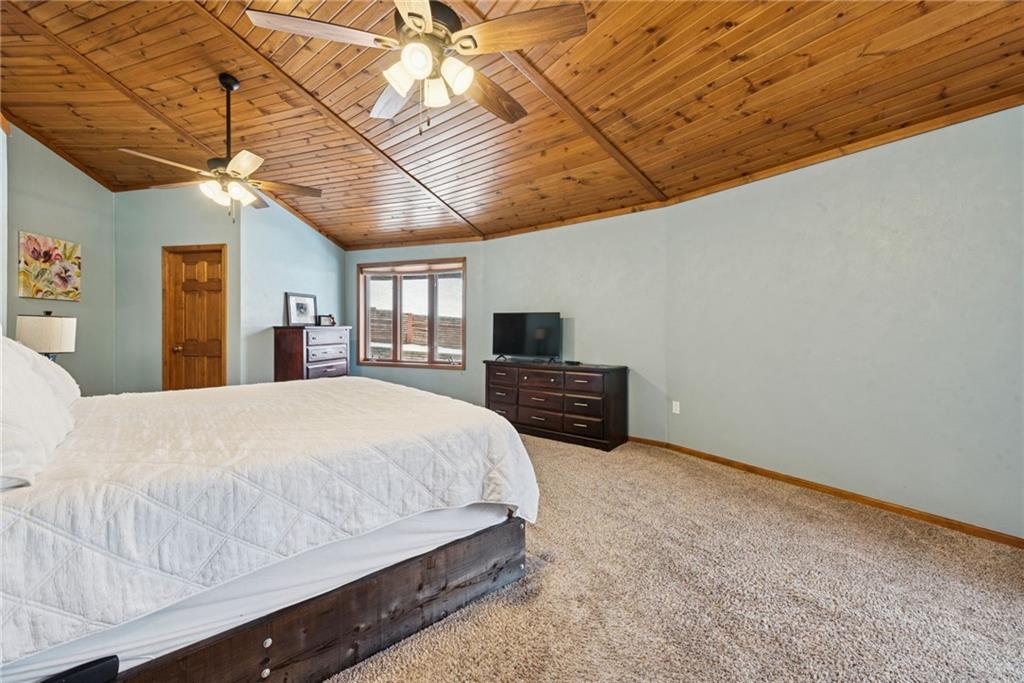 50 Potato Run Road Washington, PA 15301 - Photo 23 of 43 a spacious bedroom with a bed and a chandelier