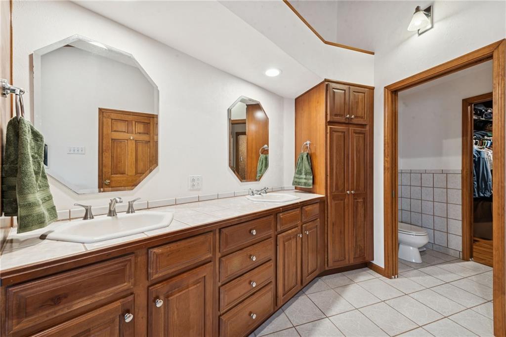 50 Potato Run Road Washington, PA 15301 - Photo 26 of 43 a bathroom with a double vanity sink and a mirror