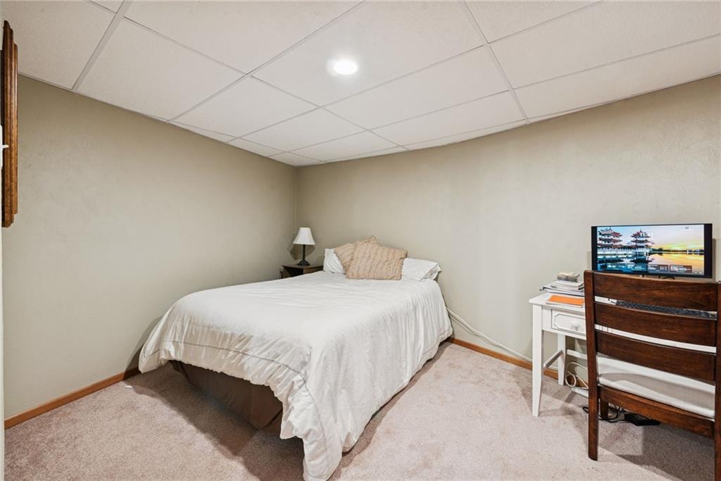 50 Potato Run Road Washington, PA 15301 - Photo 32 of 43 a bedroom with a bed and a lamp on the dresser
