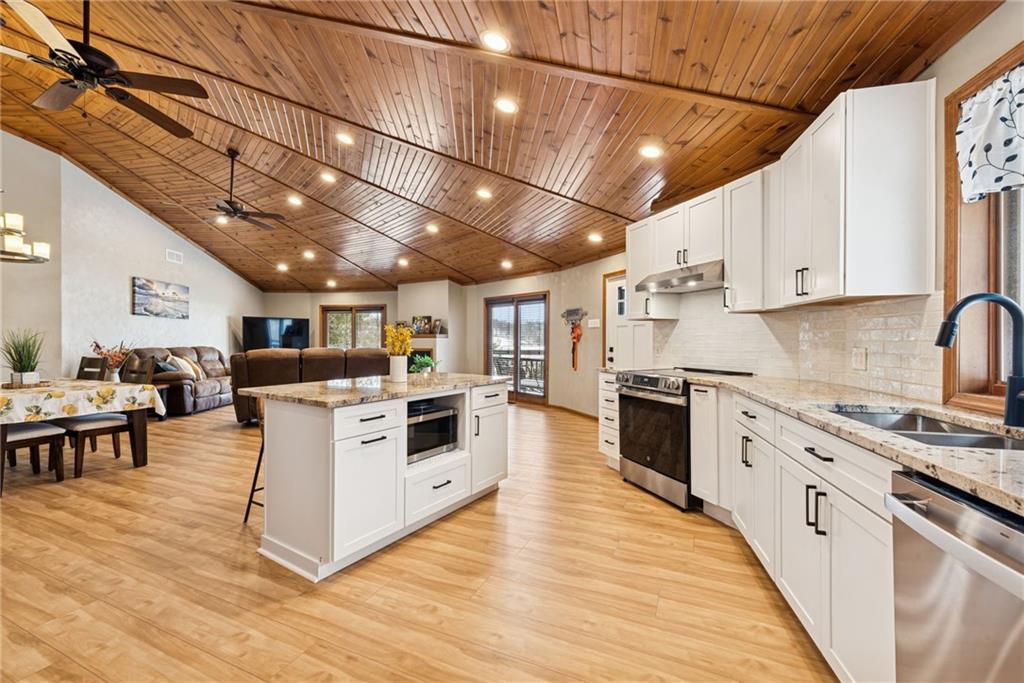 50 Potato Run Road Washington, PA 15301 - Photo 8 of 43 a large white kitchen with lots of counter top space a sink a stove and wooden floors