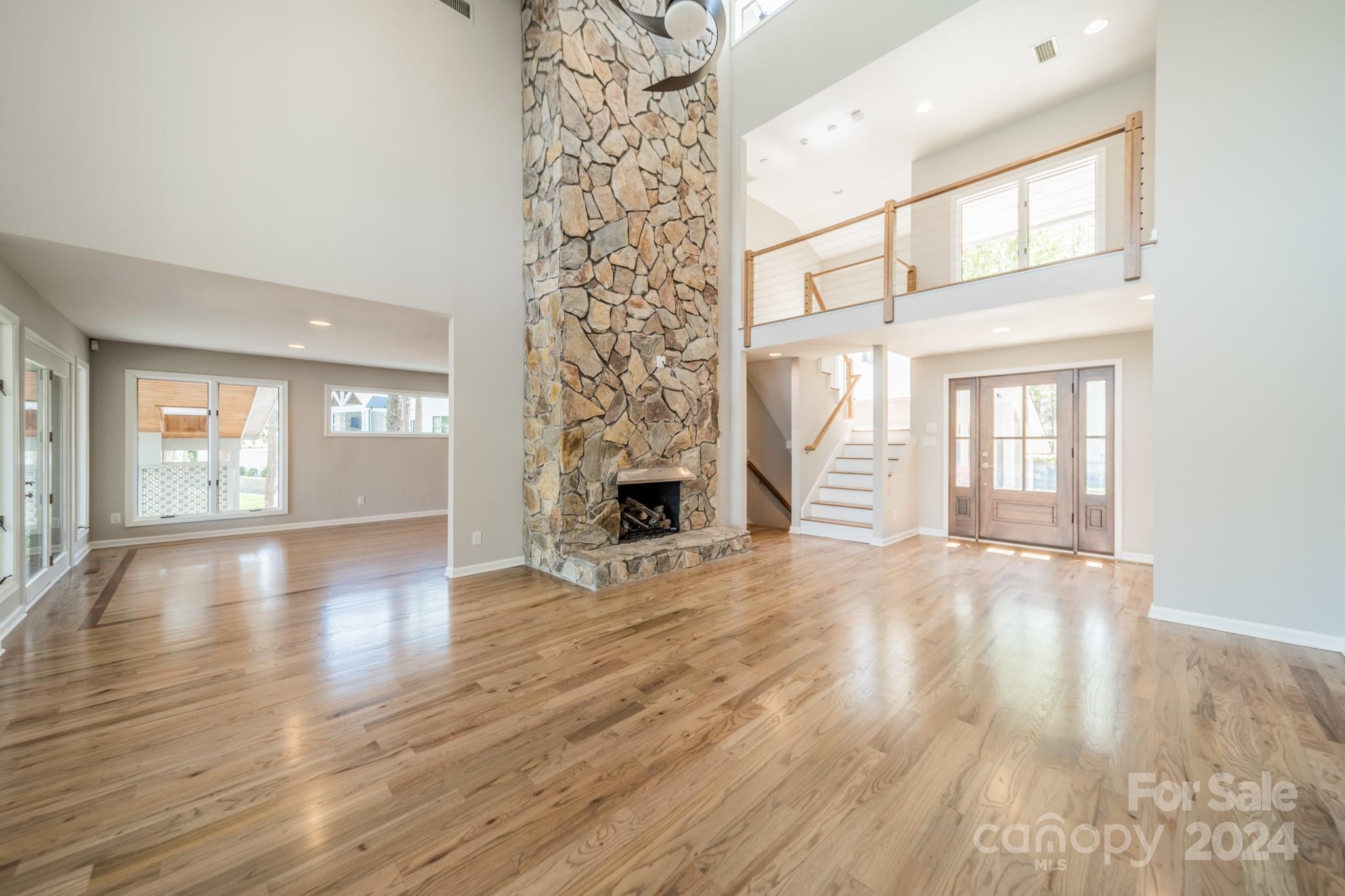 114 Stonemarker Road Mooresville, NC 28117 - Photo 15 of 38 a view of an empty room with wooden floor and a window
