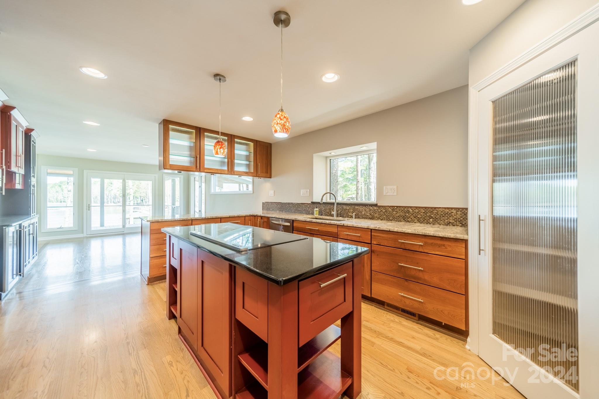 114 Stonemarker Road Mooresville, NC 28117 - Photo 18 of 38 a kitchen with stainless steel appliances granite countertop a stove and a sink