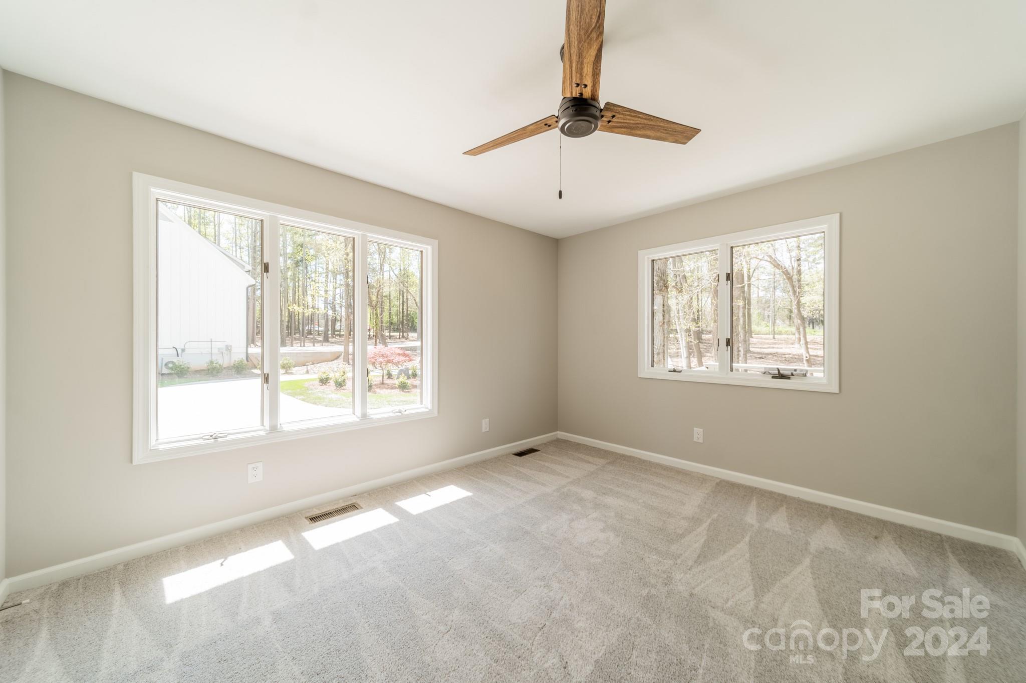 114 Stonemarker Road Mooresville, NC 28117 - Photo 22 of 38 a view of an empty room with a window