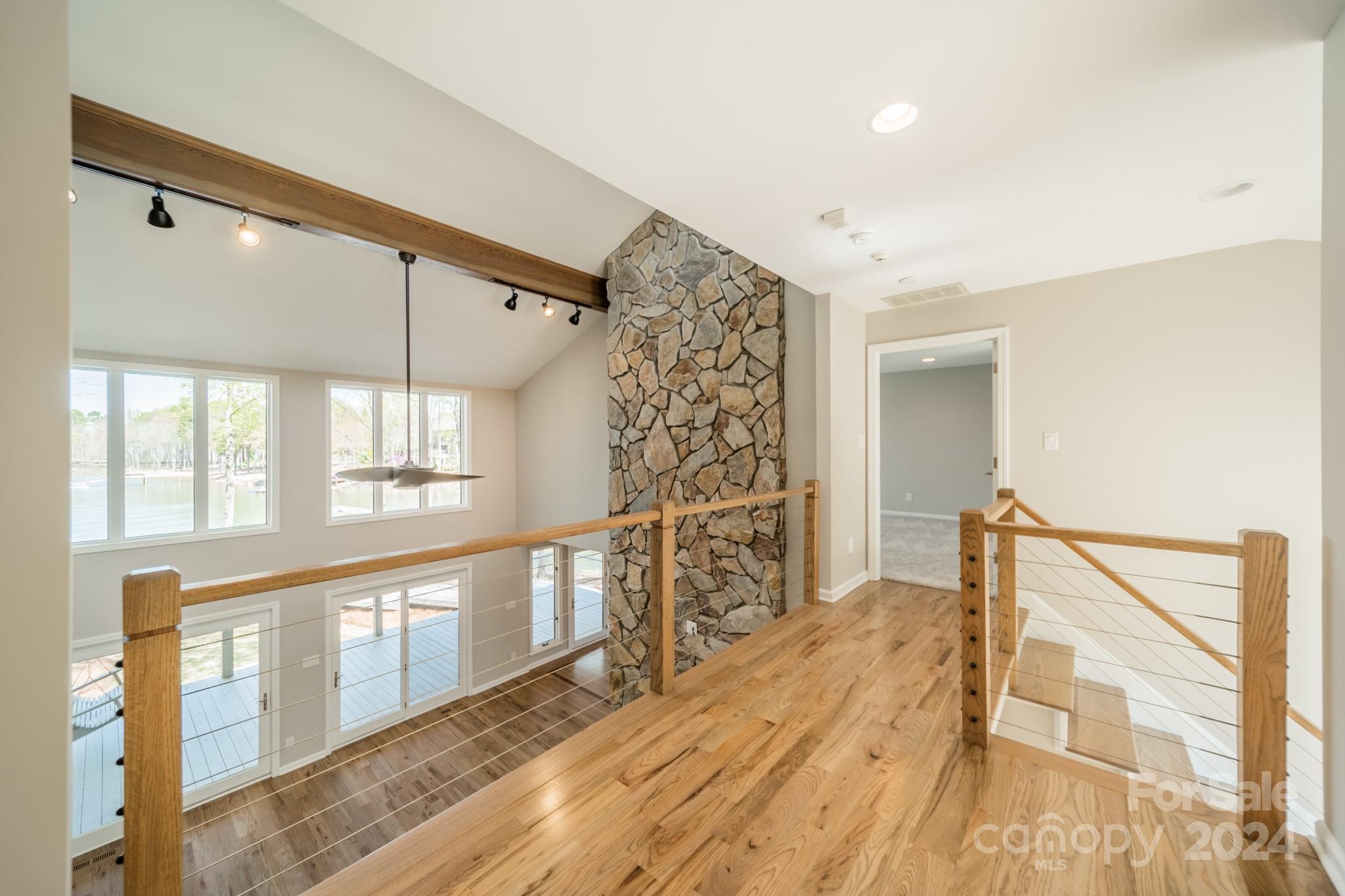 114 Stonemarker Road Mooresville, NC 28117 - Photo 23 of 38 a view of empty room with wooden floor and fan