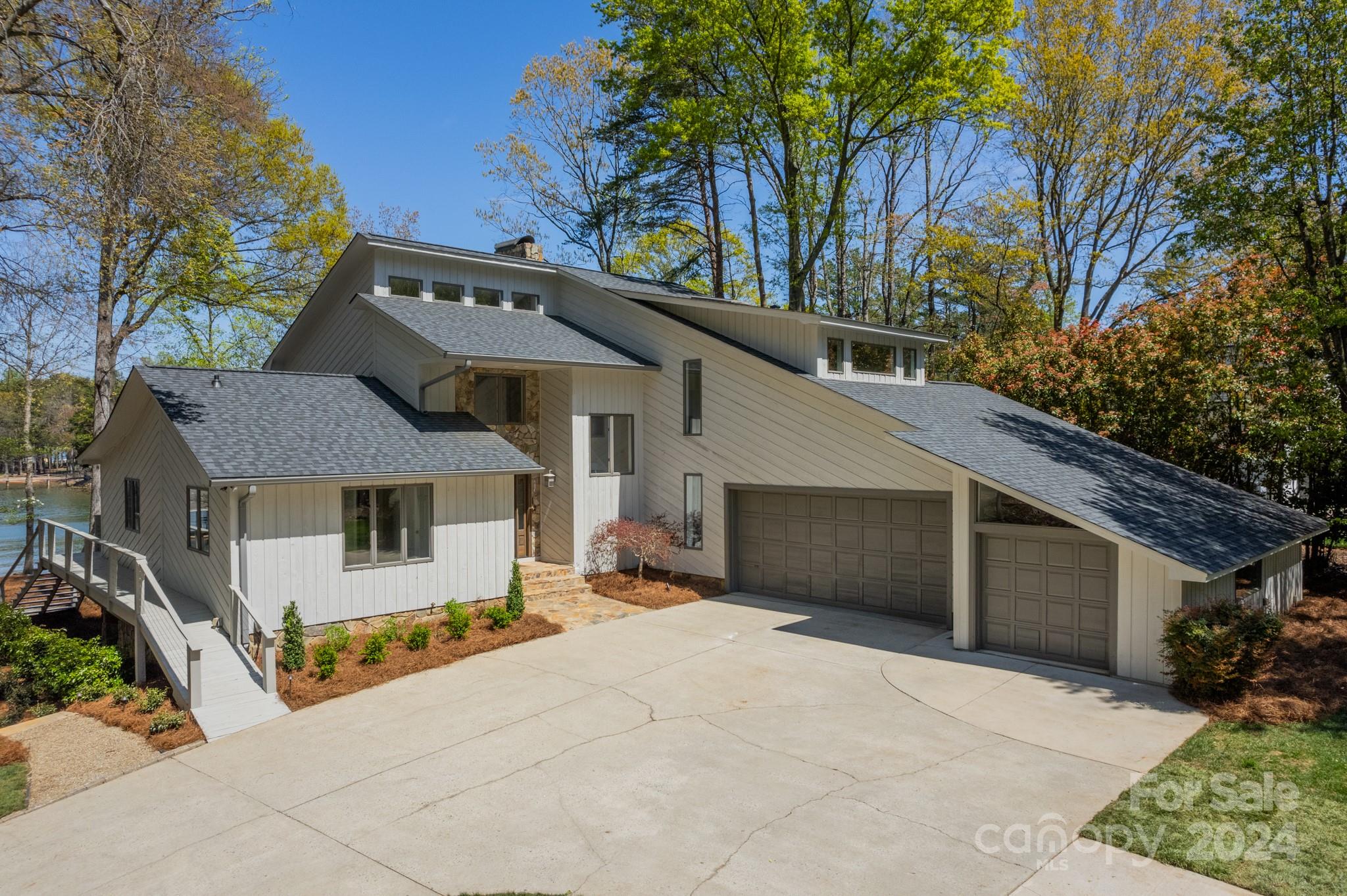 114 Stonemarker Road Mooresville, NC 28117 - Photo 3 of 38 a front view of a house with a yard and garage