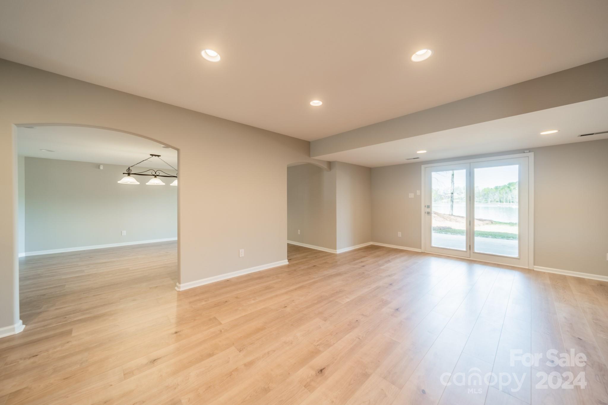 114 Stonemarker Road Mooresville, NC 28117 - Photo 31 of 38 an empty room with wooden floor and windows
