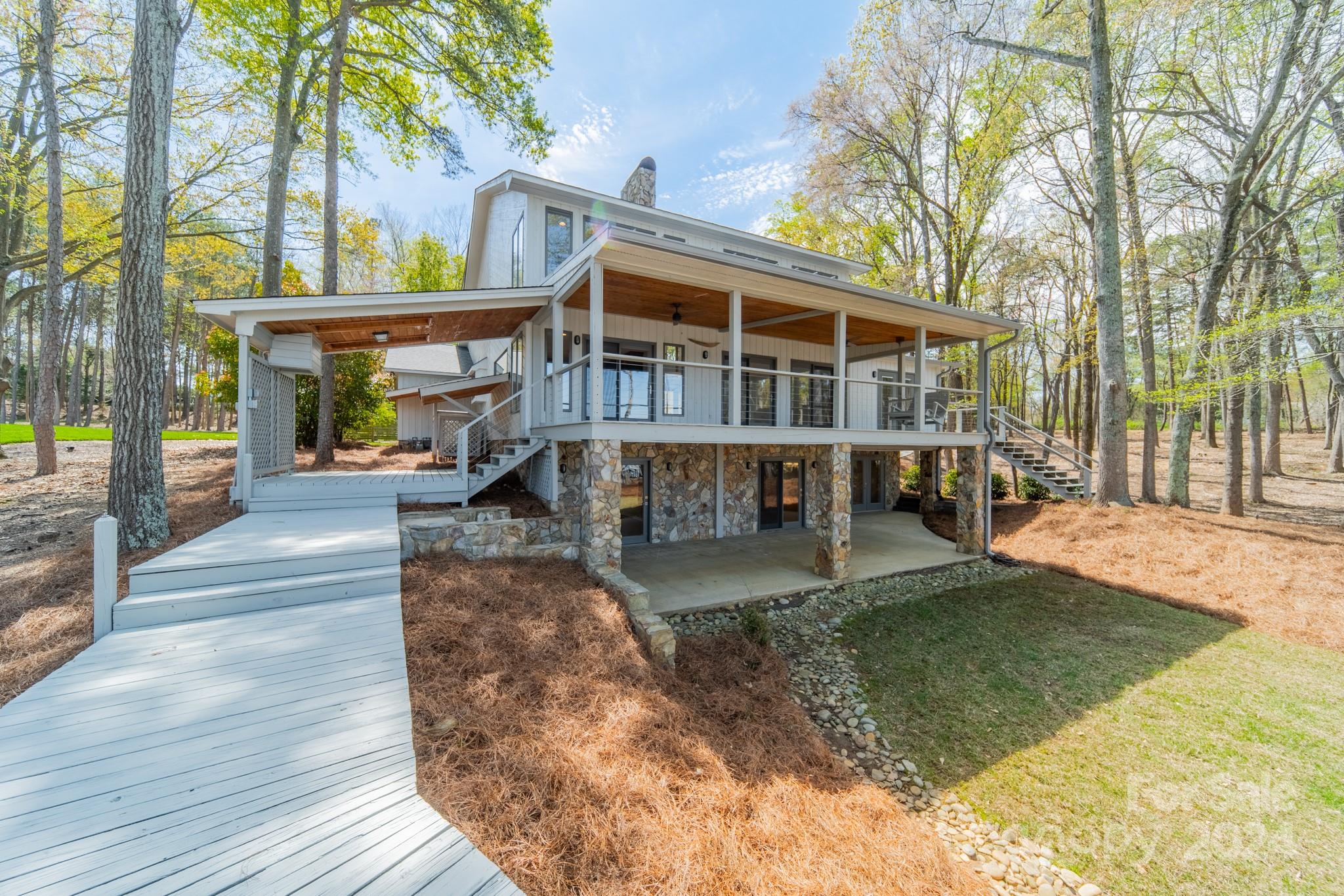 114 Stonemarker Road Mooresville, NC 28117 - Photo 35 of 38 a view of a house with a yard balcony and wooden floor