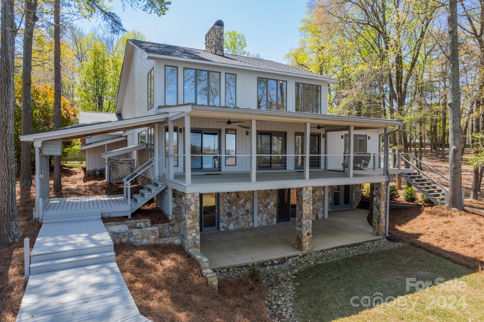 114 Stonemarker Road Mooresville, NC 28117 - Photo 8 of 38 a view of a house with wooden deck and furniture